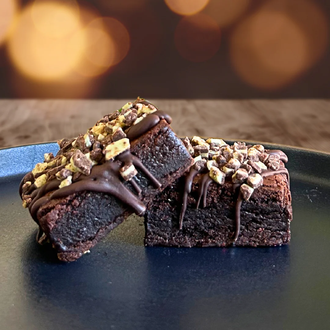 Andes Mint brownies topped with chocolate drizzle and chopped mint candies
